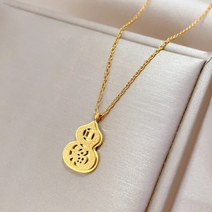 Minimalist gold titanium steel necklace with lucky gourd pendant on beige background