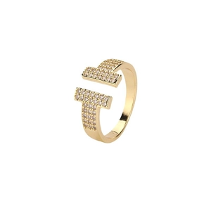 Golden double T-shaped open ring with micro-pave cubic zirconia on a white background