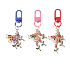 Rainbow cloud and tulip keychain set in blue, pink, and red metal with enamel charms