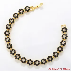 Detail of 8.0mm wide gold floral tennis bracelet with black and clear zircons