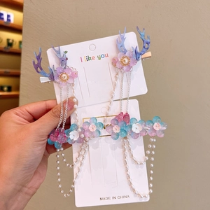Close-up of Hanfu flower hair clips with blue deer antlers and faux pearl tassels