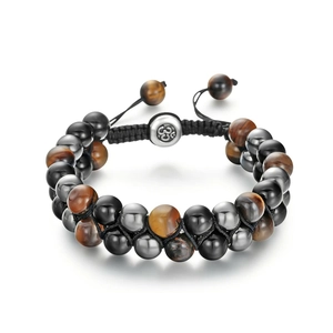 Detailed close-up of double-layer woven tiger eye and black beads with engraved OM charm