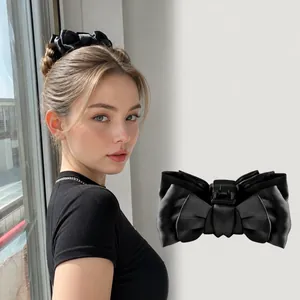 Elegant double-sided black ribbon bow claw clip for women's hairstyle and hair accessory