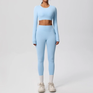 Women's light blue yoga set with long sleeve crop top and high waist leggings
