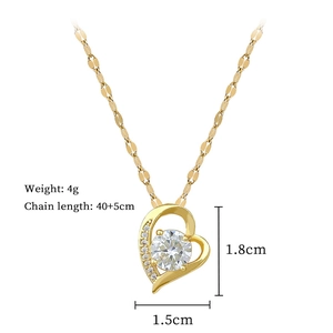Detail showing gold heart necklace dimensions 1.8x1.5cm and 4g weight with cubic zirconia