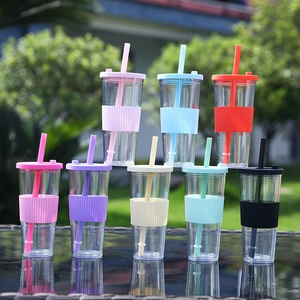 Detailed view of colorful double wall plastic straw cups with silicone sleeves and lids.