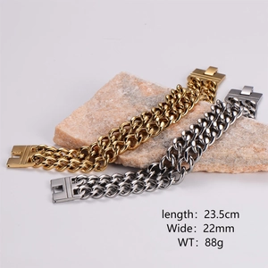 Detail view of 22mm wide Cuban link bracelets in gold and silver finish on stones