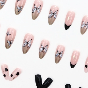 French almond press-on nails with butterfly, heart, and star patterns in pink and grey