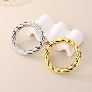 Polished chunky spiral twisted bangle in 18k gold and silver plated stainless steel
