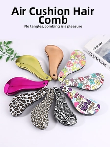 Top view of ergonomic detangling hairbrushes in leopard, floral, and metallic styles