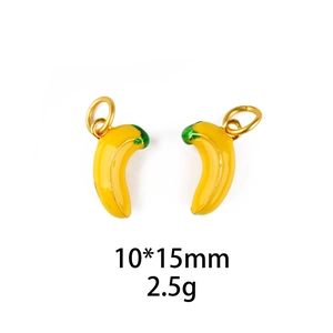 Macro shot of 10x15mm yellow banana charms with green enamel detail and gold loops