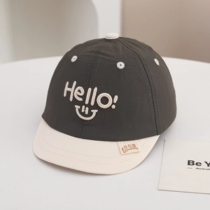 Close-up of quick-dry baby baseball cap featuring Hello embroidery and soft visor