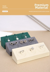 Close-up of microfiber jewelry display stands with three slots for rings and necklaces