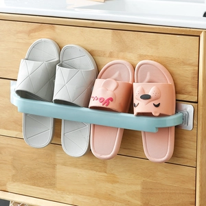 Green wall-mounted bathroom towel rack and slipper holder with minimalist design