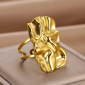 Modern 18K gold plated stainless steel ring with abstract molten lava texture design