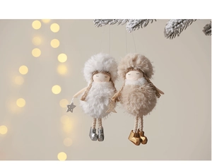 Detail of plush angel dolls in white and khaki hanging on snowy Christmas tree branches