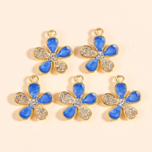 Detail of 5-piece gold-plated flower pendants with blue enamel and sparkling rhinestones