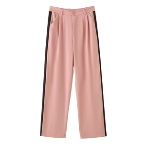 Detail of pink high-waisted wide leg trousers with black side stripes and pleats