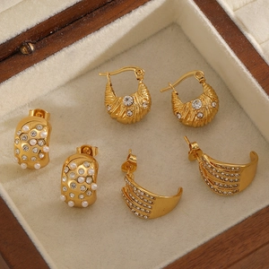 Luxury gold stainless steel earrings set with pearls and zircon in a jewelry box