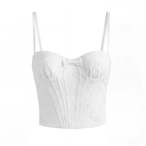 Haut corset blanc en dentelle brodée avec nœud décoratif et baleines de maintien