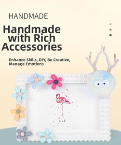 Detail of 4x6 DIY building block photo frame with floral decor and plush doll accent