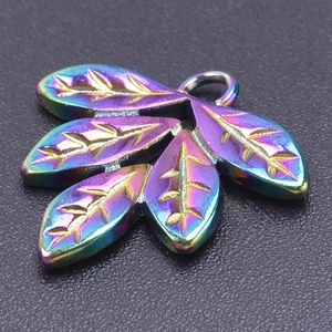 Macro shot of a rainbow-colored stainless steel leaf pendant with detailed vein patterns