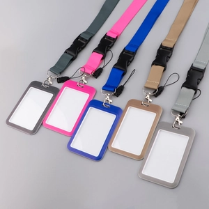 Detailed flat lay of five assorted color card holders with matching neck lanyards and clips