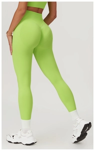 Macro shot of neon green seamless yoga leggings featuring scrunch butt lifting detail