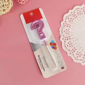 Detail view of pink metallic question mark birthday candle in its retail packaging