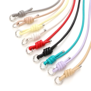 Detailed close-up of multi-color leather phone straps with silver metal spring ring buckles