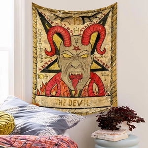 Detail of bohemian The Devil tarot tapestry hanging as a vintage wall decoration