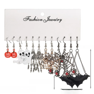 Detailed view of 6-pair Halloween earring set with ghosts and pumpkins on display card
