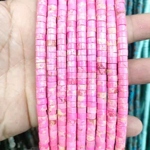 Close-up of pink disc-shaped natural stone beads with organic marbled textures for DIY jewelry