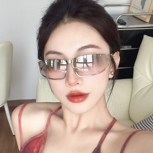 Futuristic silver metal square sunglasses with brown gradient lenses on a female model