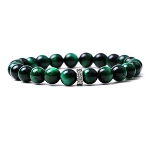 Macro detail of natural green tiger eye beaded bracelet with silver textured metal spacer