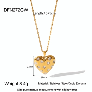 Detail view of gold heart pendant in stainless steel with cubic zirconia and dimensions