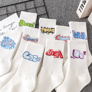 White cotton mid-calf sports socks with colorful graffiti lettering and urban street style