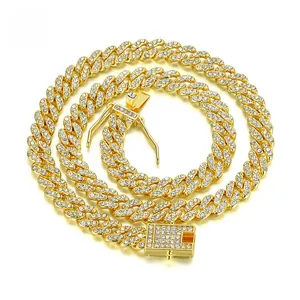 Macro shot of iced out Cuban link chain with gold plating and square pavé diamond clasp