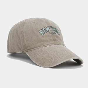 Detail of vintage washed khaki baseball cap with New York USA embroidery on the front