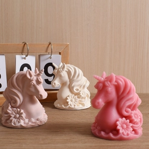 Detail of unicorn candle mold with floral base showing intricate hair and daisy textures