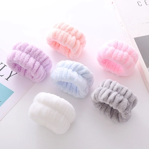 Set of six colorful plush wristbands in pink, purple, blue, white, and grey coral fleece