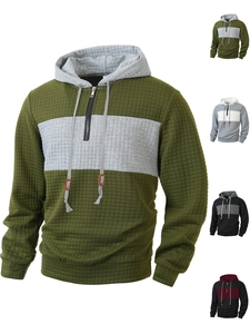 Macro detail of men waffle texture hoodie fabric with half-zipper collar and contrast stitching