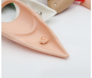 Macro view of latex elf ear prop with sparkling clear rhinestone detail for cosplay
