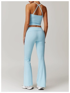 Light blue cross-strap sports top and high-waisted yoga pants for fitness training