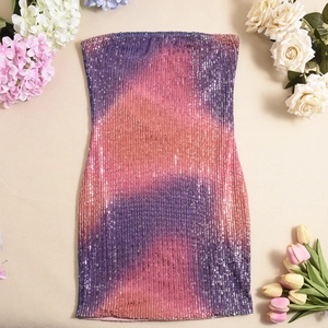 Detailed view of shimmering gradient sequins on a purple and pink tube dress