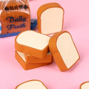 Close-up of creative toast bread erasers in daily fresh packaging on pink background