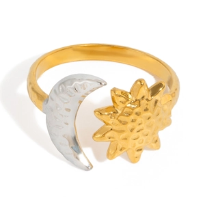 Close-up of adjustable sun and moon ring featuring hammered 18K gold and silver textures
