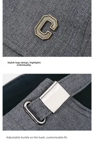 Detail of grey fabric baseball cap featuring a metal C letter and adjustable silver buckle