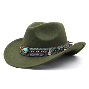 Detail of western cowboy hat featuring ethnic woven band and turquoise ornament