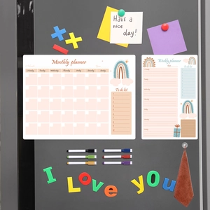 Magnetic weekly and monthly dry erase planners with rainbow design on a grey refrigerator